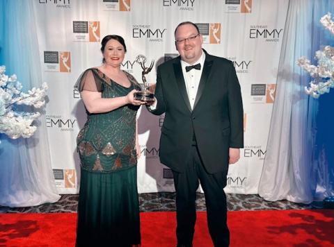 Dr. Emily Stafford and Dr. Michael Nadorff Holding Emmy